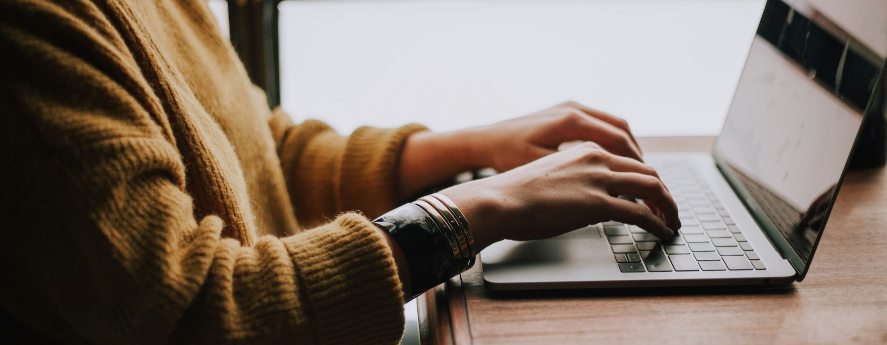 a person typing on a laptop